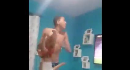 Aficionado festeja gol sacudiendo a su hijo (VIDEO)