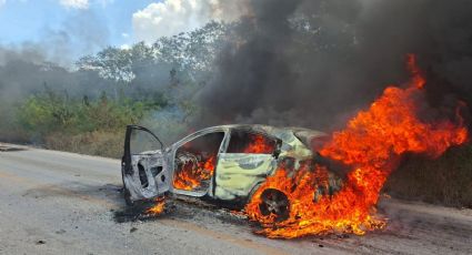 Localizan cuerpo calcinado en auto