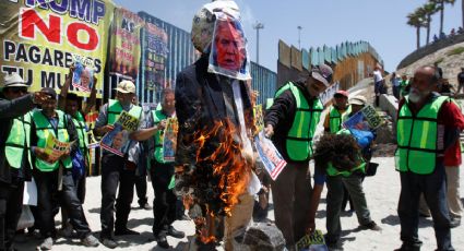Migrantes en Tijuana protestan contra Trump por muro fronterizo