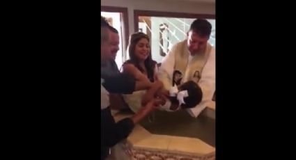 Niña insulta a sacerdote durante su bautizo (VIDEO) 