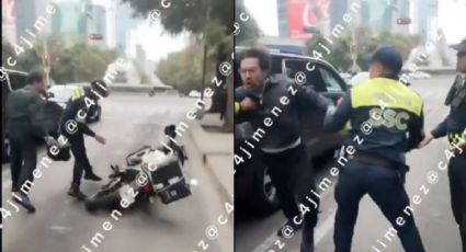 Motociclista agrede a policías tras meterse al carril del Metrobús | VIDEO